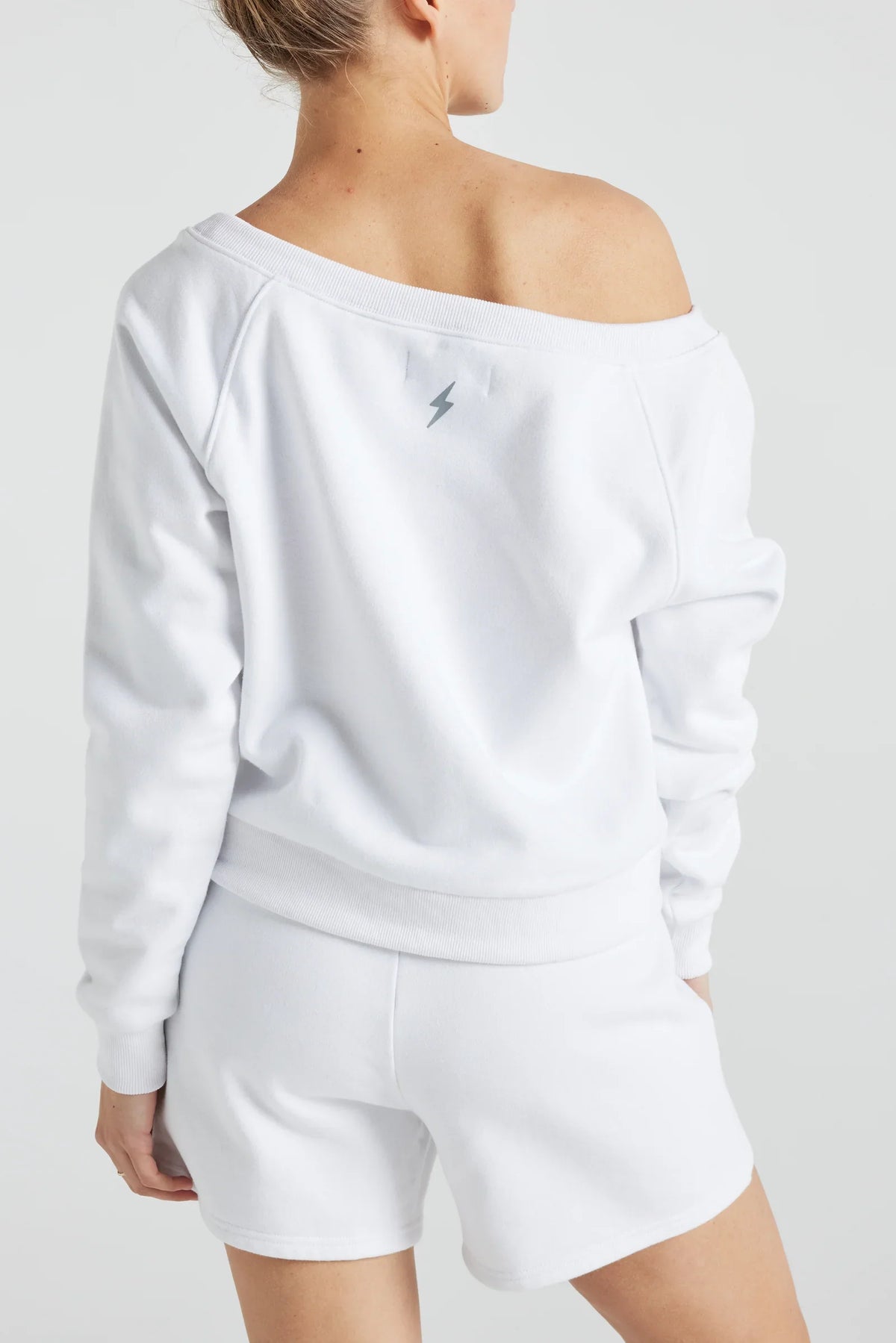 White off-shoulder sweatshirt by Fitkitty Culture, women's athleisure and yoga wear, casual clothing for comfortable style.