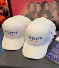 White Fitkitty Logo Baseball Cap, casual hat with adjustable strap, featuring the Fitkitty Culture brand logo.