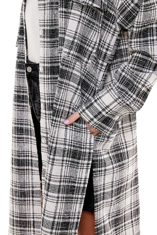 Black oversized plaid shacket, jacket by Fitkitty Culture Athleisure Wear, featuring a long, relaxed fit and classic plaid pattern.