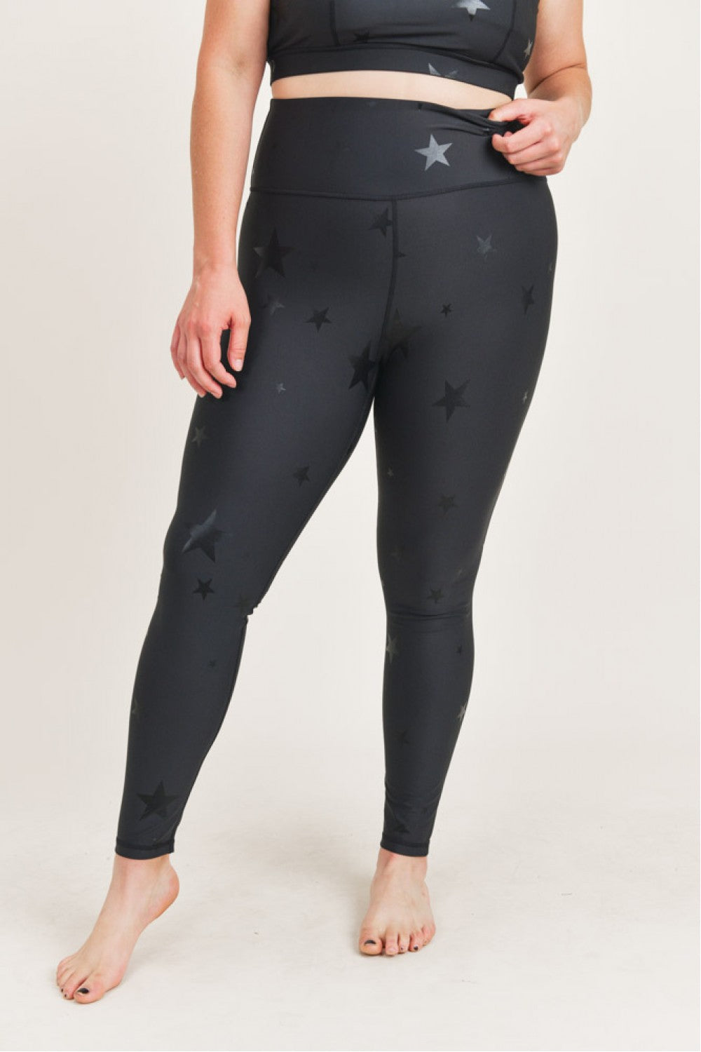 Black Starlight High Waisted Leggings by Fitkitty Culture, stylish women's yoga and athleisure leggings with starry pattern.