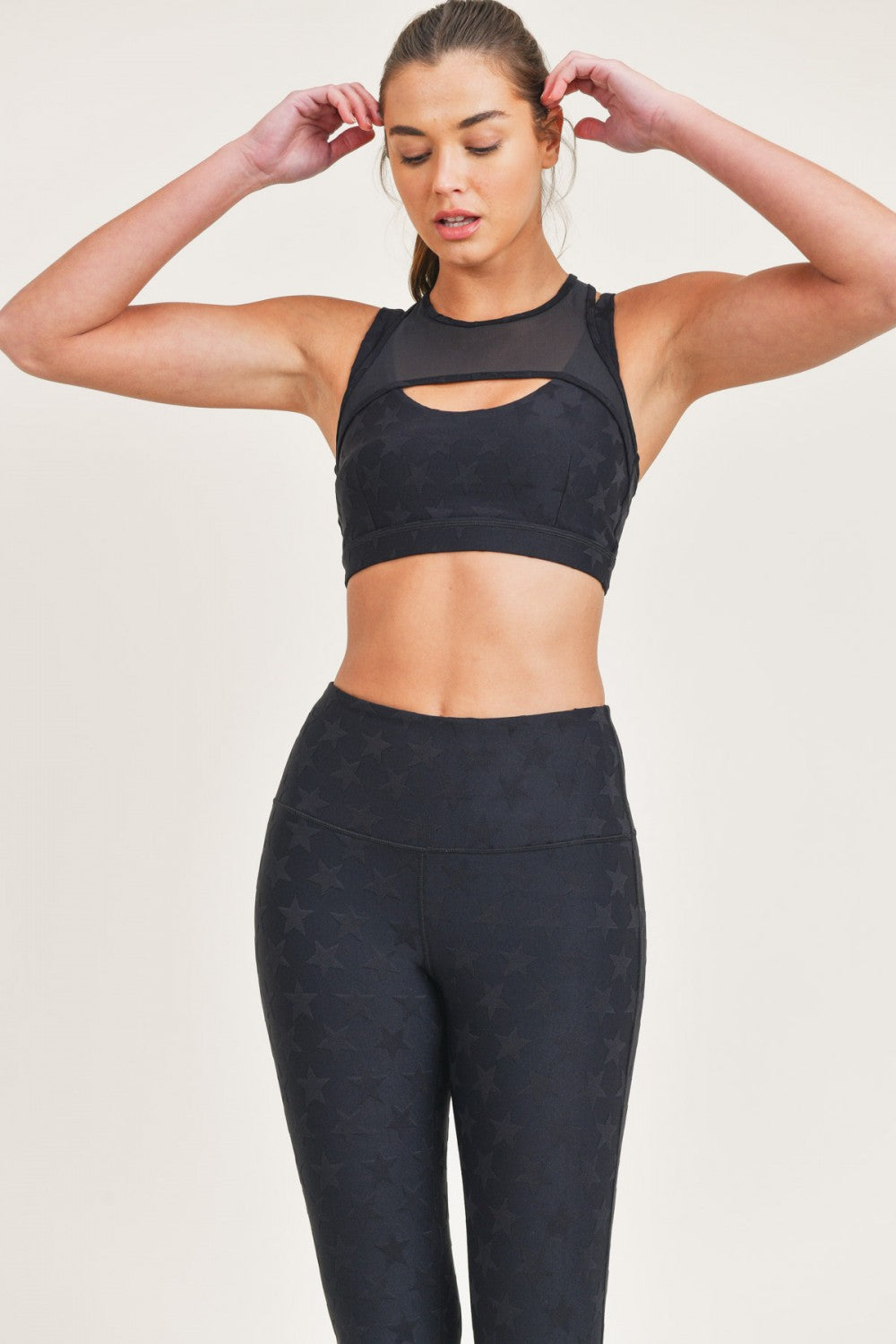 Black Joystar Sports Bra by Fitkitty Culture, lightweight and supportive activewear for women’s yoga and exercise sessions.
