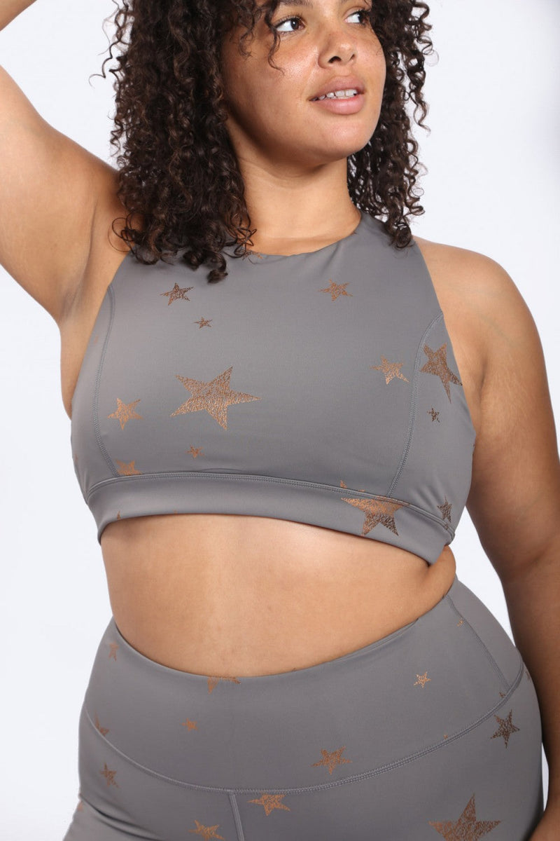 Black Fitkitty Culture Starlight Star Foil Sports Bra with subtle star pattern, designed for active yoga and workout wear.