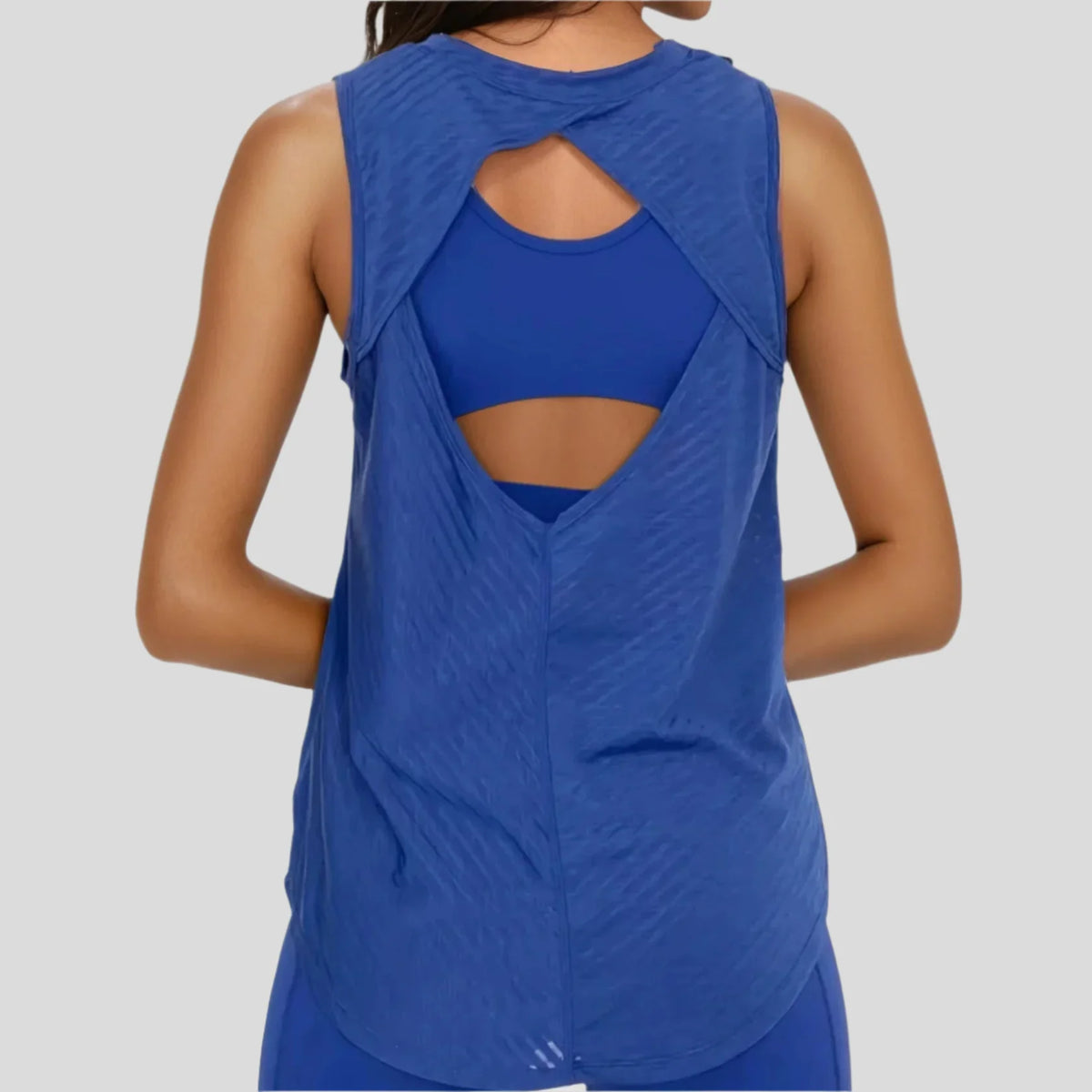 Blue sheer striped mesh active tank top with a cut-out back from Fitkitty Culture women's yoga and athletic wear.