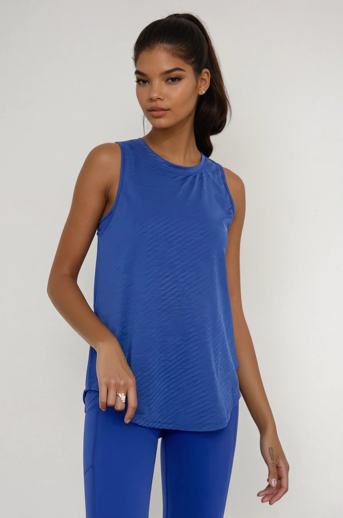 Blue sheer striped mesh active tank top with cut-out back by Fitkitty Culture, perfect for yoga and active wear.