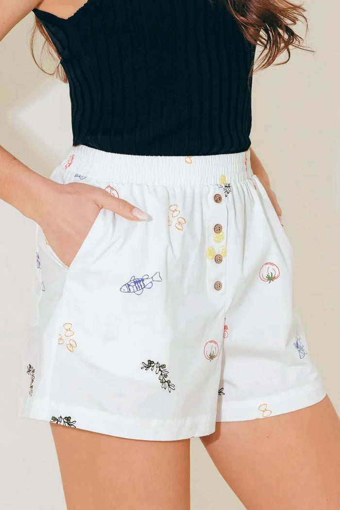 Flying Tomato white woven shorts, casual pants with a relaxed fit, displayed on a flat-lay with detailed fabric texture.