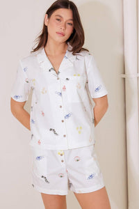 Flying Tomato After Hours white woven shorts, stylish casual pants with a relaxed fit, showcased on a model.