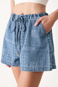 Light indigo vintage bandana denim shorts by Flying Tomato, featuring a classic distressed look and frayed hem.