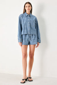Light indigo vintage bandana denim shorts by Flying Tomato with a relaxed fit and frayed hem detail.