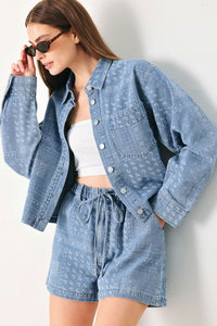 Light indigo vintage bandana denim shorts by Flying Tomato with distressed details and rolled cuffs.