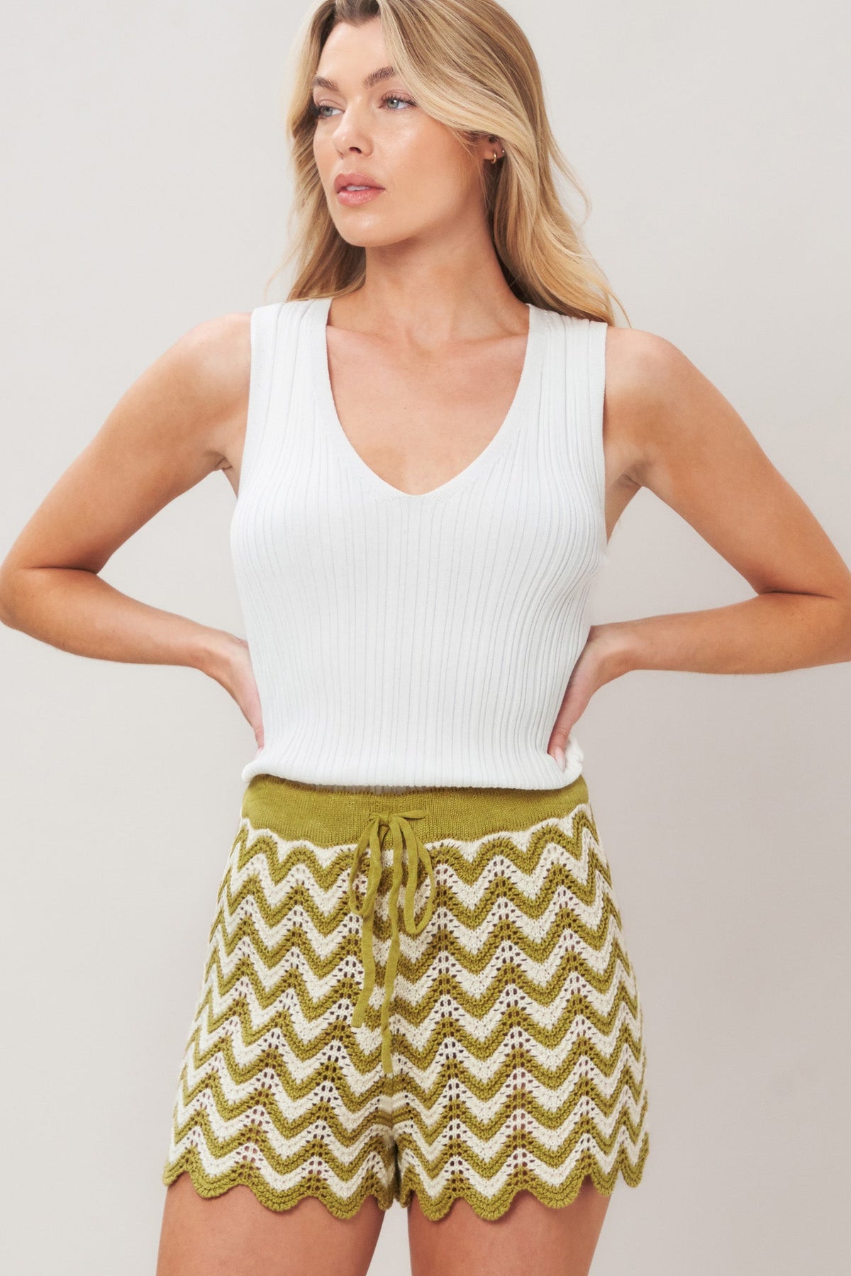 Olive and white crochet knit shorts by Flying Tomato featuring sunset stitch pattern and casual fit.