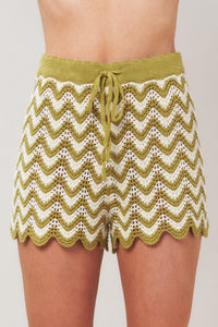 Olive and white Sunset Stitch crochet knit shorts by Flying Tomato featuring a relaxed fit and textured crochet pattern.