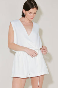 White Flying Tomato Summer Icon Mode woven shorts with a relaxed fit and adjustable waistband, shown on a model.