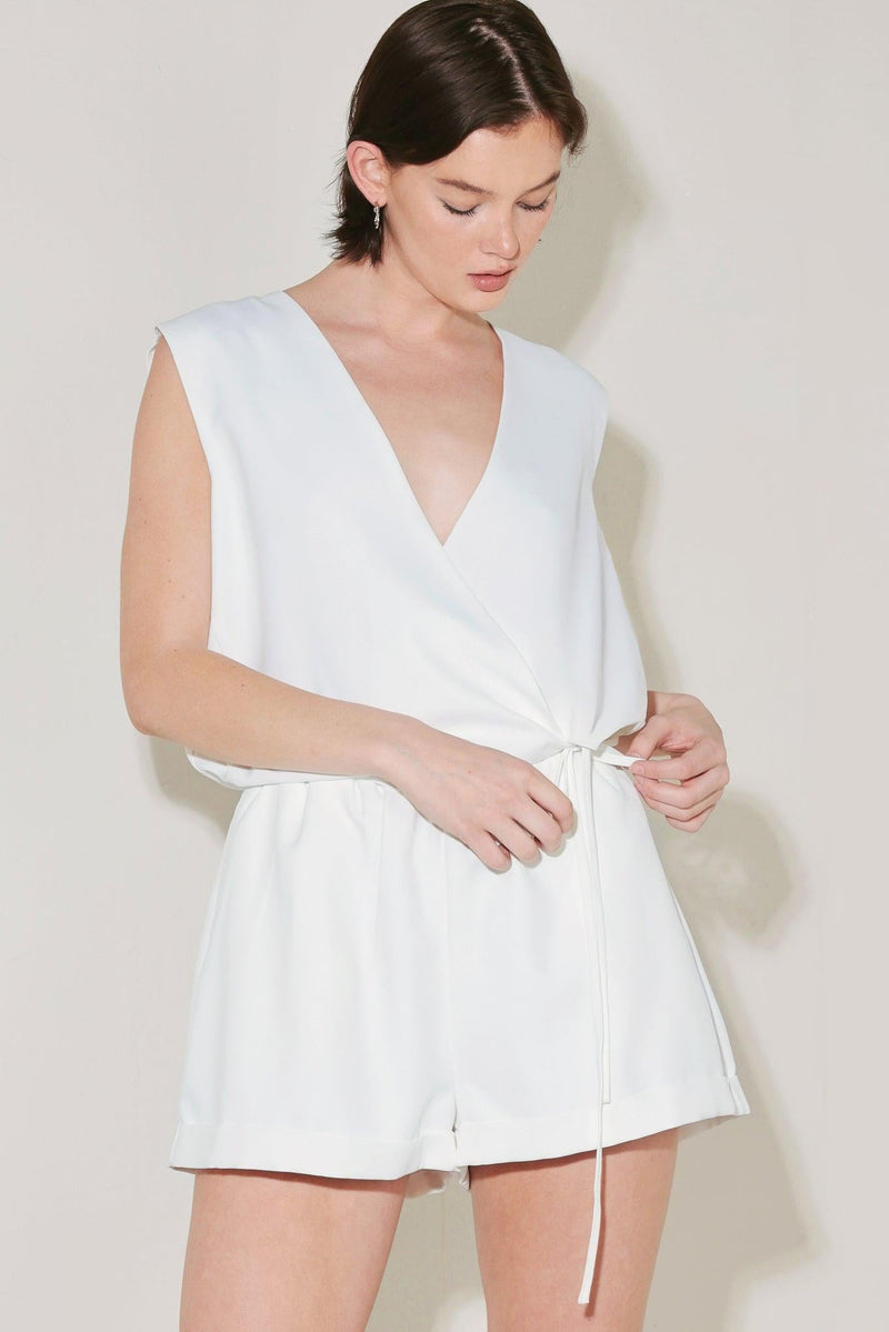 White Flying Tomato Summer Icon Mode woven shorts with a relaxed fit and adjustable waistband, shown on a model.