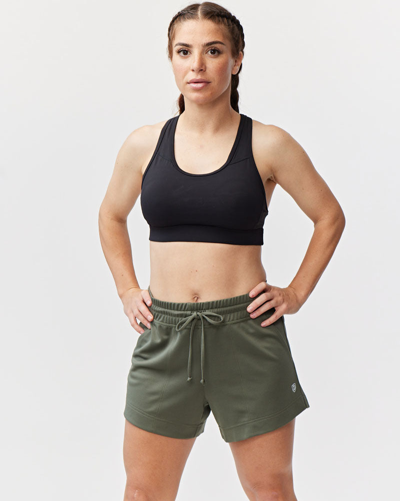 Dark moss green Goal Five G5 Advance 4.5-inch knit shorts laid flat showing elastic waistband and stitched detailing.