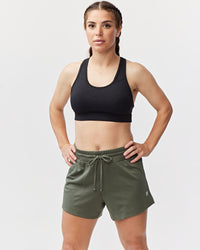 Dark moss green Goal Five G5 Advance 4.5-inch knit shorts laid flat showing elastic waistband and stitched detailing.
