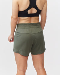Dark moss green Goal Five G5 Advance 4.5-inch knit shorts shown on a mannequin, highlighting casual athletic style.
