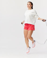 Goal Five G5 Advance 4.5-inch knit shorts in hot coral, showing the comfortable, stretchy fabric and casual fit.