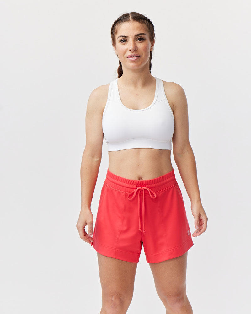 Goal Five G5 Advance 4.5-inch knit shorts in hot coral, showing the soft fabric and casual fit on a model.