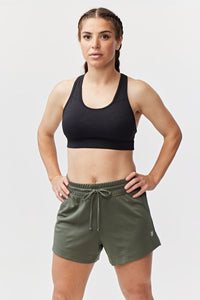 Dark moss green Goal Five G5 Advance 4.5-inch knit shorts, casual athletic style, shown on a model.