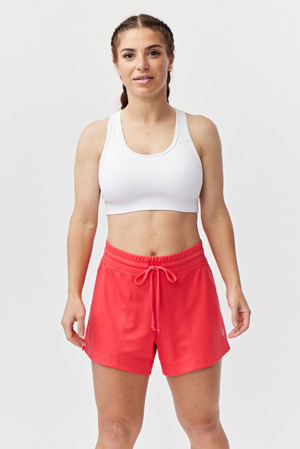 Goal Five G5 Advance 4.5-inch knit shorts in hot coral, showing the comfortable fit and textured fabric design.