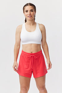 Goal Five G5 Advance 4.5-inch knit shorts in hot coral, showing the comfortable fit and textured fabric design.