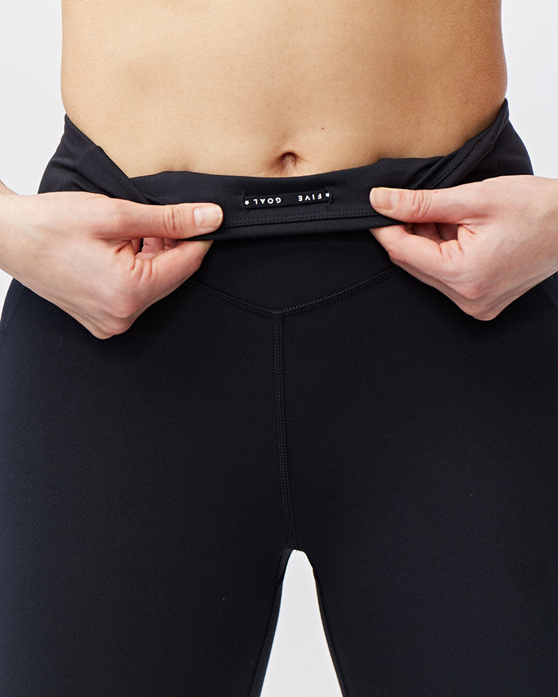 Black Goal Five Go Again women's full-length leggings with crop-length design, stretchy fabric, and comfortable fit.