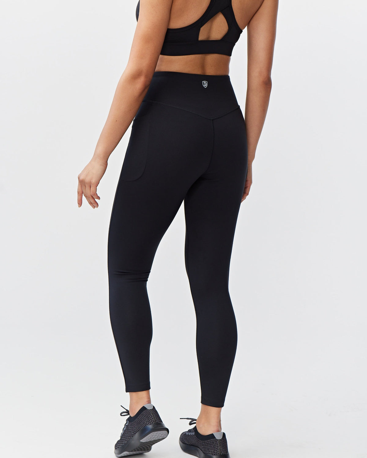 Goal Five Go Again women's full-length black leggings, 7-8 length, shown on a model for activewear or casual wear.