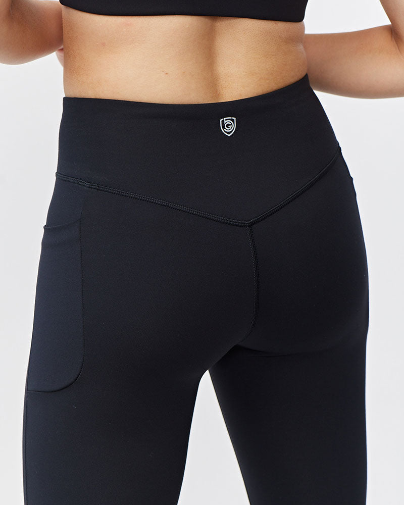 Goal Five Go Again women's full length black leggings, crop length style, shown on a model for activewear.