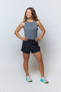 Goal Five boxy crop tank top displayed on a model, featuring a relaxed fit and stylish cropped design.