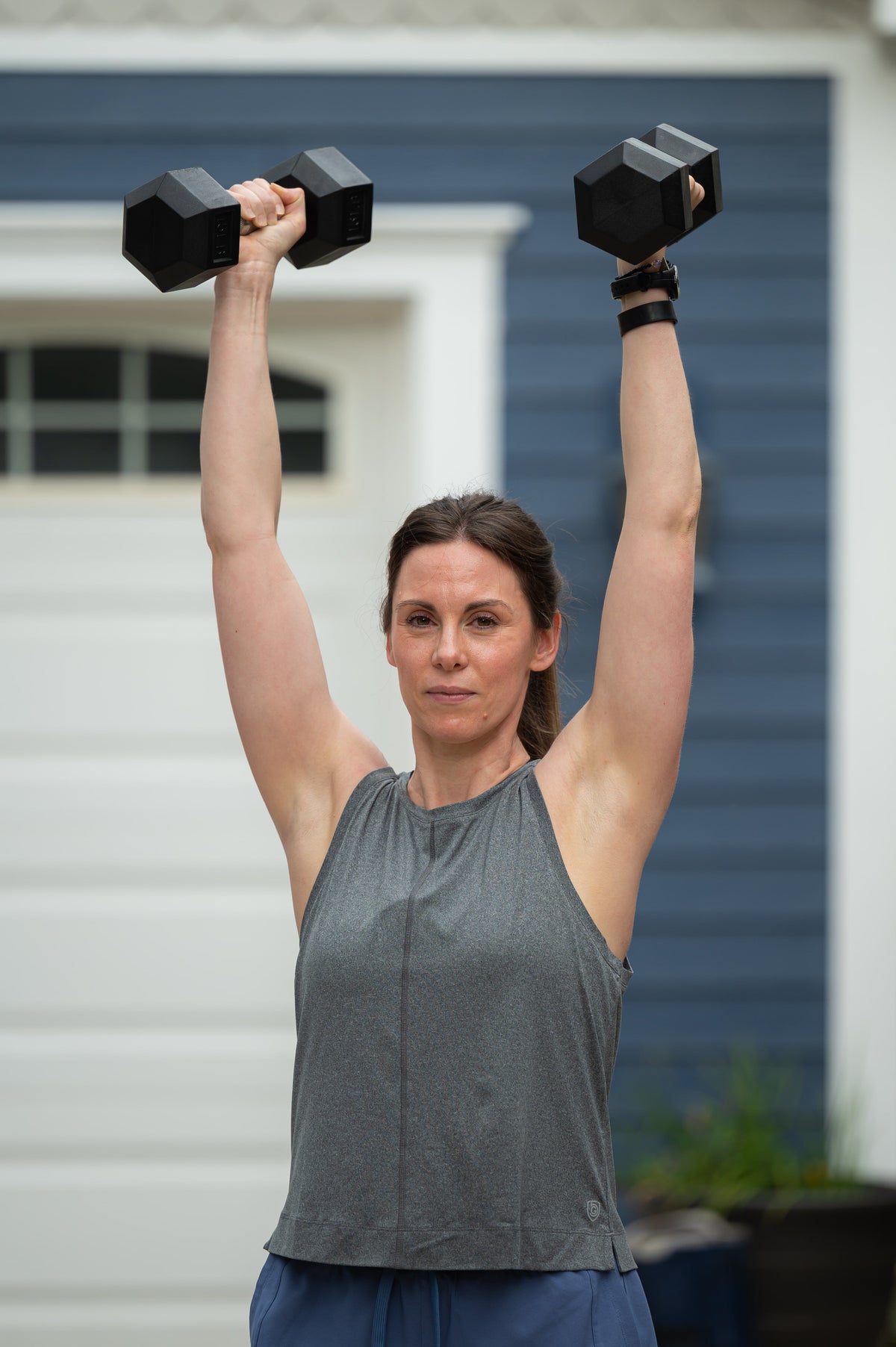 Goal Five boxy crop tank top displayed on a hanger, showcasing its relaxed fit and minimalist style.