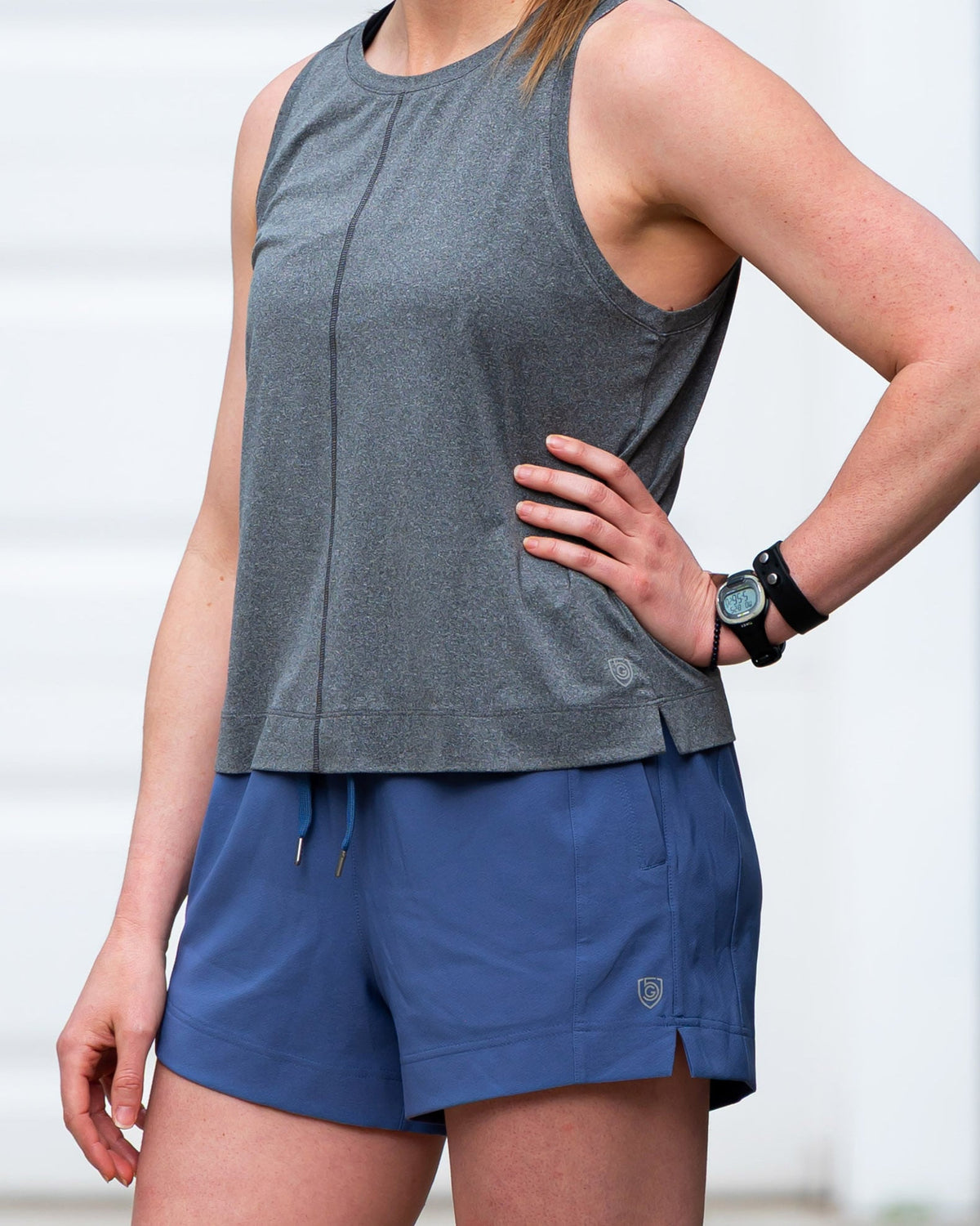 Goal Five boxy crop tank top displayed on a model, showcasing its relaxed fit and stylish design.