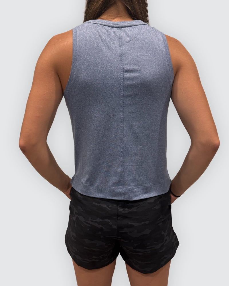 Goal Five blue boxy crop tank top shown from the back, highlighting its relaxed fit and sleeveless design.