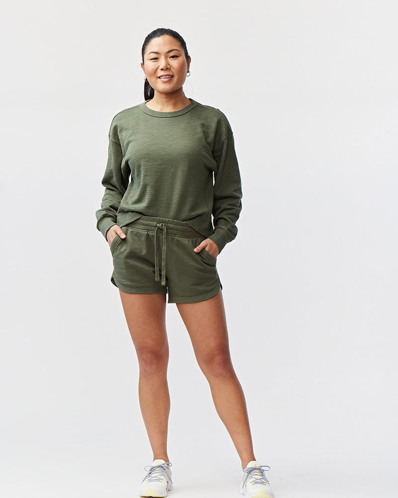 Goal Five Freasy Short in dark moss color, lifestyle image showing comfortable casual shorts with a relaxed fit.