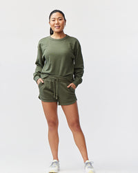 Goal Five Freasy Short in dark moss color, lifestyle image showing comfortable casual shorts with a relaxed fit.
