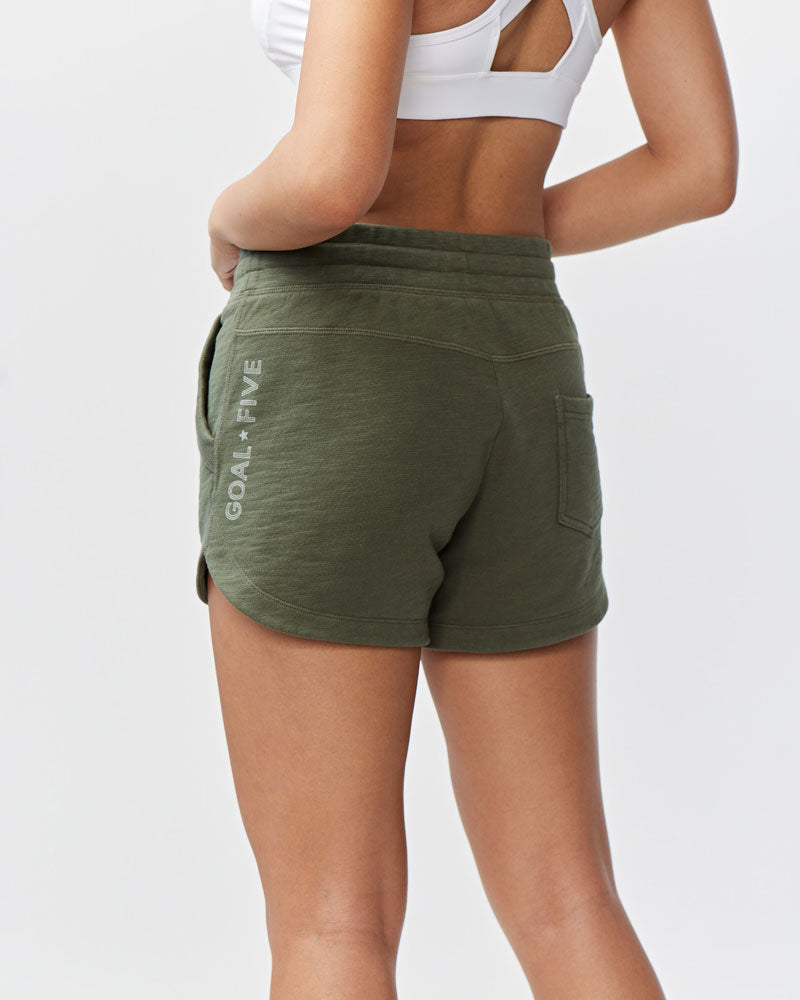 Goal Five Freasy Short in dark moss color, showcasing a relaxed lifestyle fit with a comfortable, casual design.