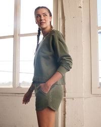 Goal Five Freasy Short in dark moss color, lifestyle shot showing casual fit and fabric texture for comfortable summer wear.