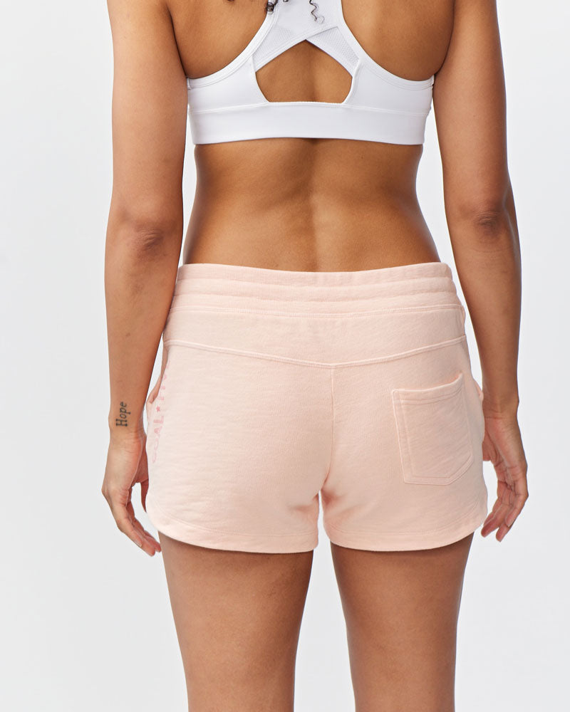 Goal Five Freasy Short lifestyle image showing the comfortable nectar-colored shorts with a relaxed fit and casual style.