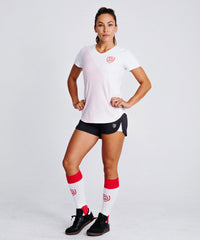 Equal Play women's soccer over-the-calf training socks in hot coral, designed for comfort and performance on the field.