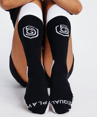 Black Goal Five Equal Play women's soccer over-the-calf training socks displayed on a white background.