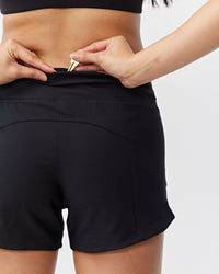 Black Excel women's workout shorts by Goal Five, designed for training and active fitness, shown on a model.