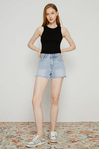 High rise denim shorts by Hey Joanie with a classic blue wash and frayed hem, styled for casual summer wear.