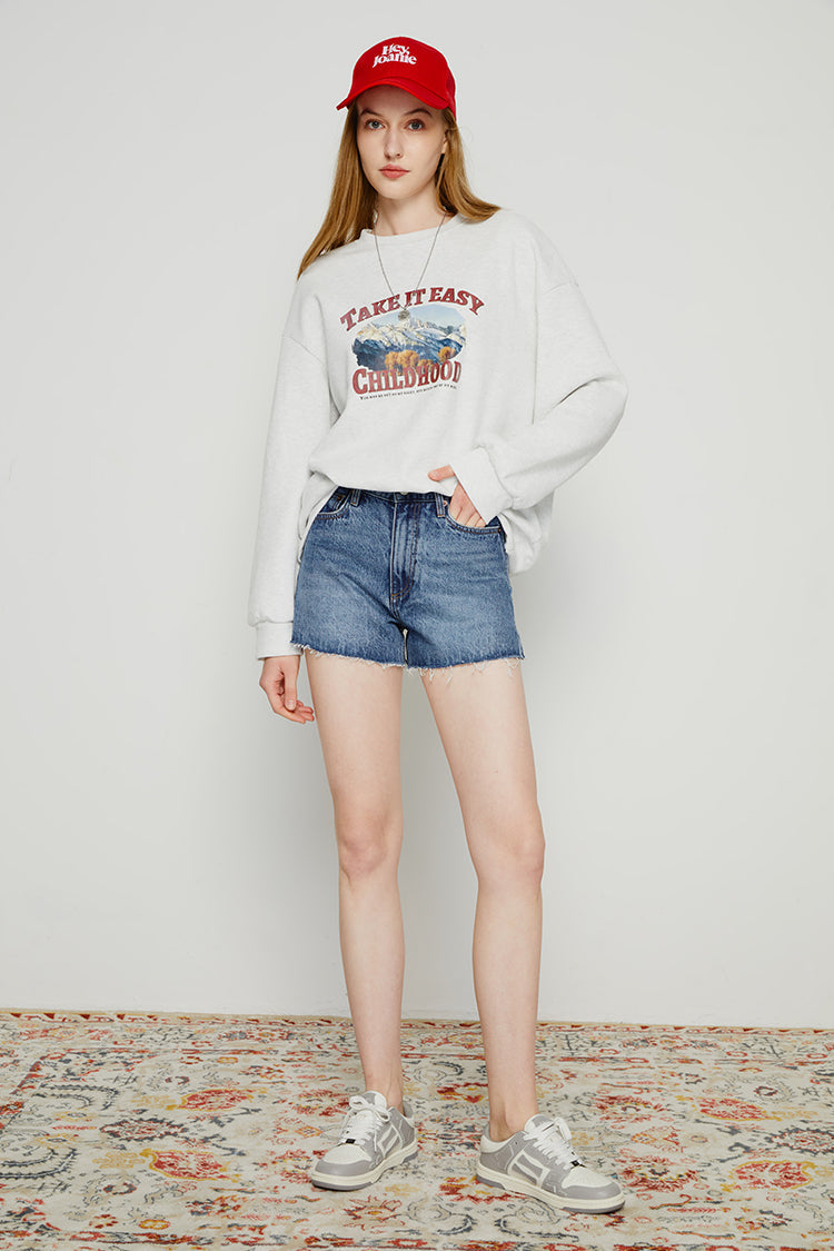 High-rise denim shorts by Hey Joanie, featuring a classic fit and distressed details, shown on a model.
