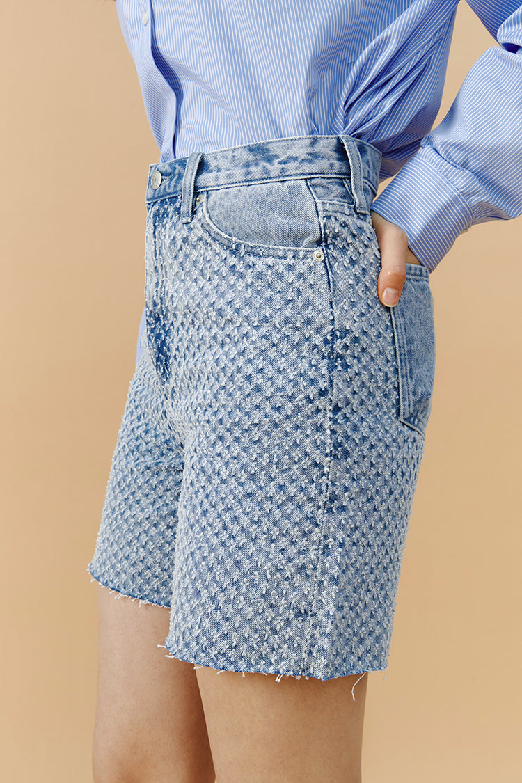 Hey Joanie Venice Tweed High Rise Shorts, styled with a tailored fit and textured fabric, perfect for casual and chic summer looks.