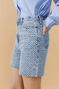 Hey Joanie Venice Tweed High Rise Shorts, styled with a tailored fit and textured fabric, perfect for casual and chic summer looks.