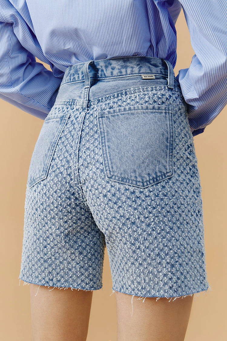 Hey Joanie Venice Tweed High Rise Shorts in stylish Tweed fabric, showcased on a model. Perfect for casual summer wear.