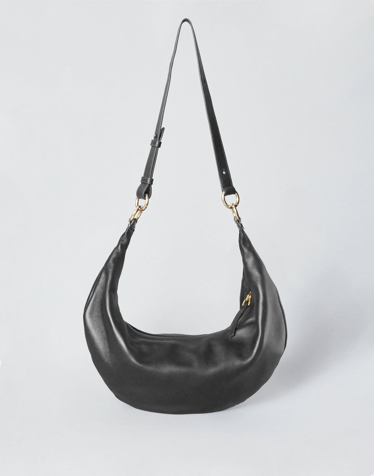HYER GOODS black leather hobo bag with gold ring detail, stylish and spacious for everyday use.