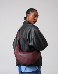 Burgundy HYER GOODS Ring Bag hobo crossbody bag with rounded shape and adjustable strap, stylish and functional for everyday use.