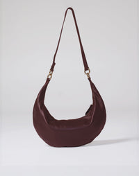 HYER GOODS Ring Bag hobo bag in burgundy leather, front view showing round ring handle and sleek design