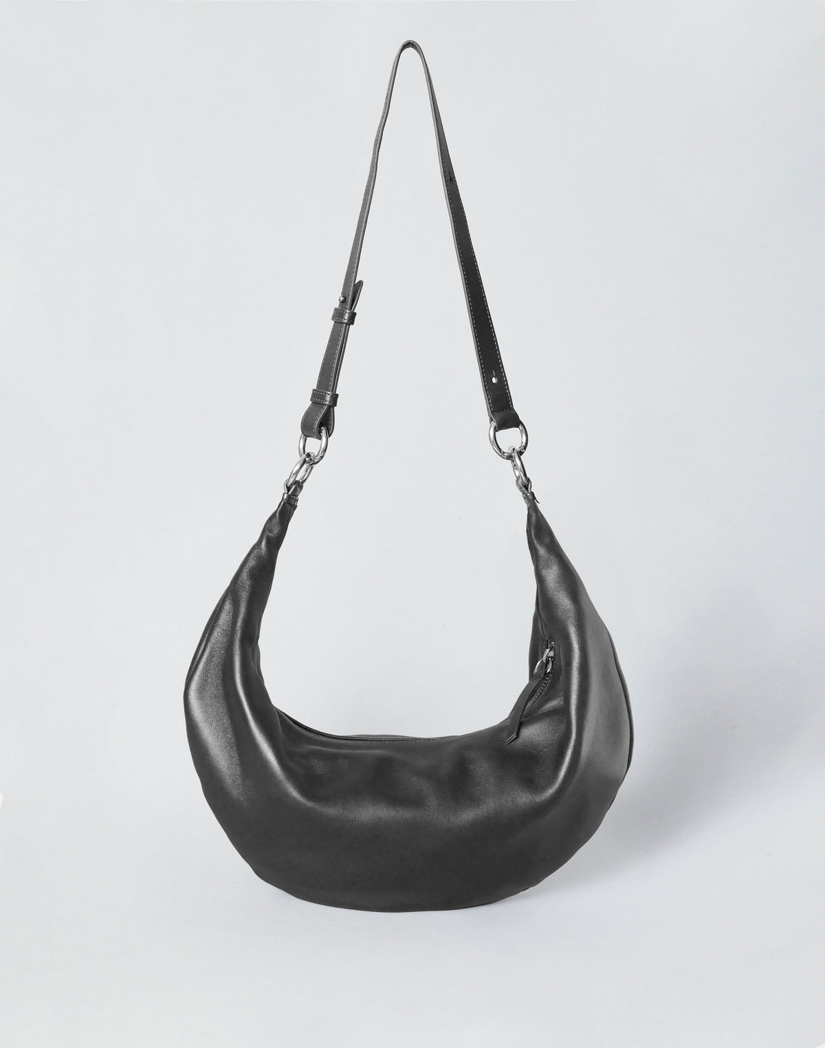HYER GOODS black leather hobo bag with silver ring detail, stylish and spacious tote for everyday use.