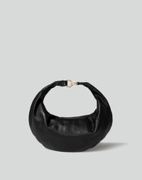 Black and gold hobo bag from HYER GOODS featuring a distinctive ring detail and a sleek front view